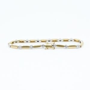 Armband Guld 14K 11,2g Längd 18cm Bredd 4mm tvåfärgat med diamanter 14xca0,05ct