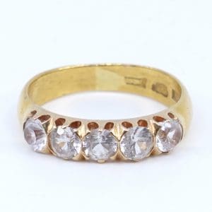 Ring Guld 23K med infattning i 18K 6,3g Ø18,50 med stenar