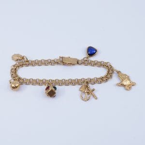 Armband X-länk Guld 18K 15,5g Längd 19cm Bredd 6mm med sex berlocker