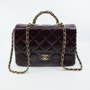 Väska Chanel "Coco handle flap bag" Kalvskinn i färgen burgundy  23,5x16x7 cm SNR: U1918CCE