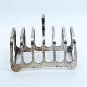 Toastställ i oädel metall. längd 11 cm