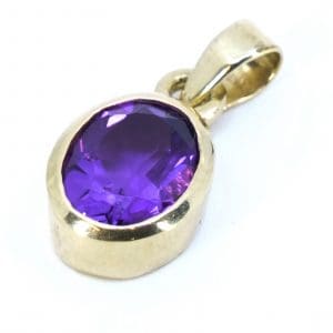 Hänge Guld 14K 1,2g Bredd 8mm Höjd 16mm med lila sten