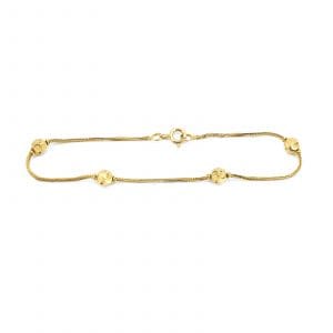 Armband Guld 21K 2,7g Längd 19cm med 4 integrerade berlocker, skev