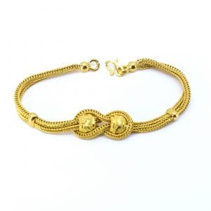 Armband fyrkantig fiskben Guld 23K 7,6g Längd 16cm Bredd 5-11mm med integrerade berlocker och S-lås