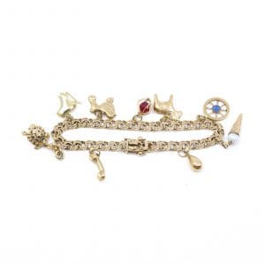 Armband Bismarck Guld 18K 21,8g Längd 19cm Bredd 5,6mm med 9st berlocker