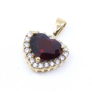 Hänge Hjärta Guld 18K 3,1g Bredd 13,5mm Höjd 11,5mm med diamanter 20x ca 0,01ct & röd sten