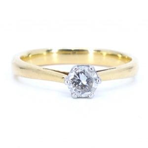 Ring tvåfärgad Guld 18K 4,2g Ø18,25 med diamant 1xca0,50ct, naggad i rondist