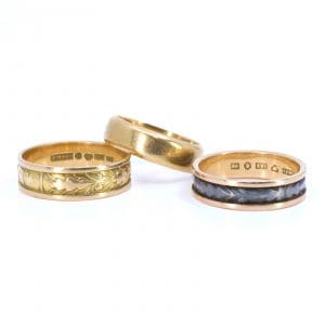 Investeringsguld 18K 14,5g graverat och med oädel metall i skena