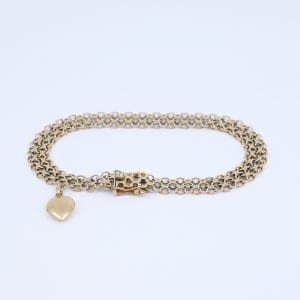 Armband X-länk Guld 18K 13,7g Längd 21cm Bredd 8mm med en berlock