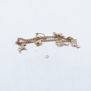 Investeringsguld 18K 11,5g med berlocker fattas en berlock