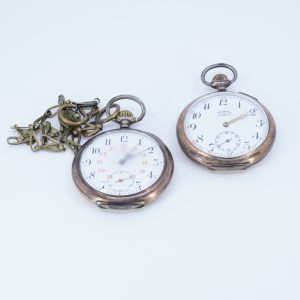 Fickur Omega och Perfecta S830, 186,2g, manuella, plexiglas, oädel klockkedja