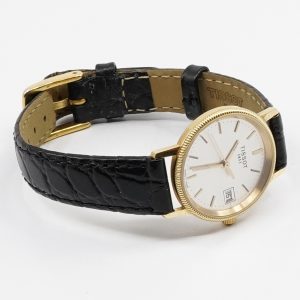 Armbandsur Tissot 18K quartz Ø23mm, graverad, med läderband Bruttovikt 17,5g